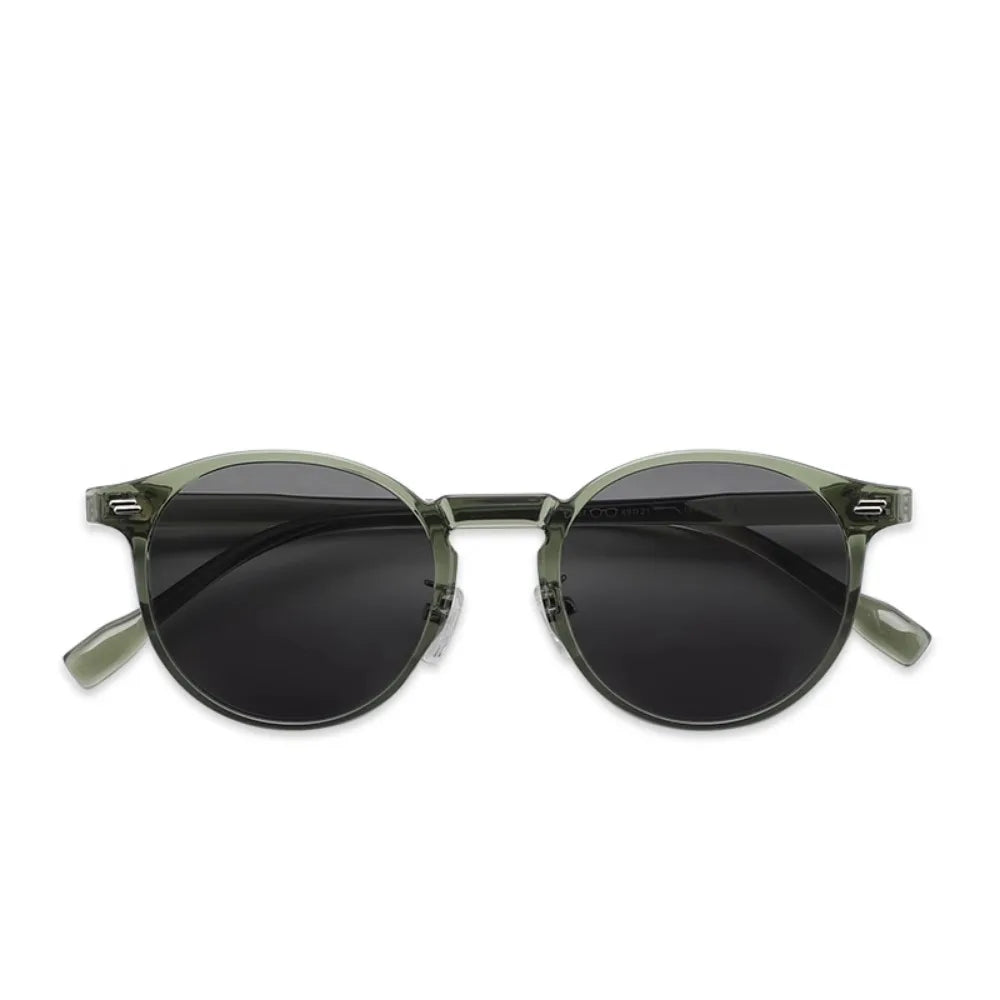 Fashionable round frame women's sunglasses in emerald green, offering UV400 protection and style.