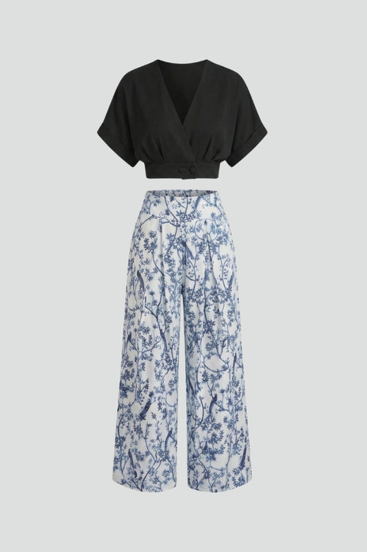 Stylish women's two-piece set featuring a V-neck top and wide-leg trousers, perfect for casual chic or resort wear.