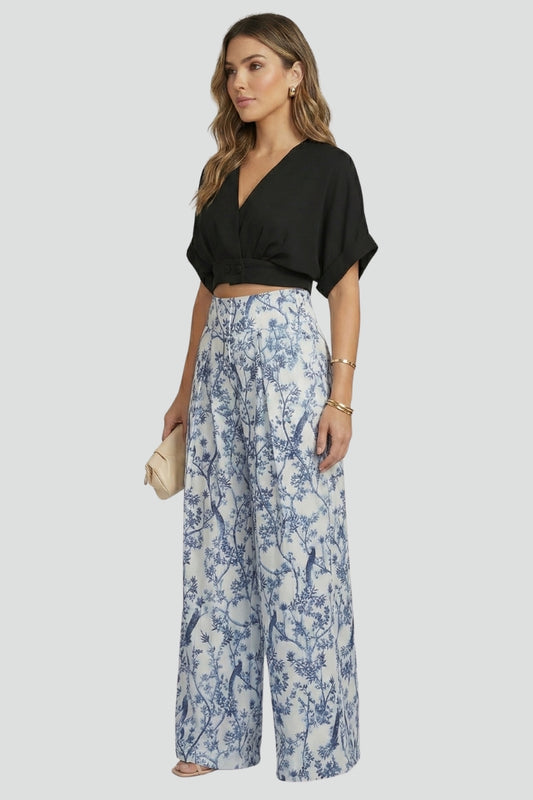 Womens matching set with a comfortable V-neck top & elegant patterned wide-leg trousers. Ideal for summer fashion.