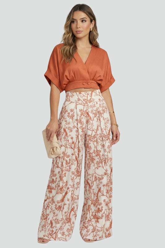 Versatile women's matching set: V-neck top and wide-leg trousers. Perfect for stylish summer outings or relaxed resort wear.