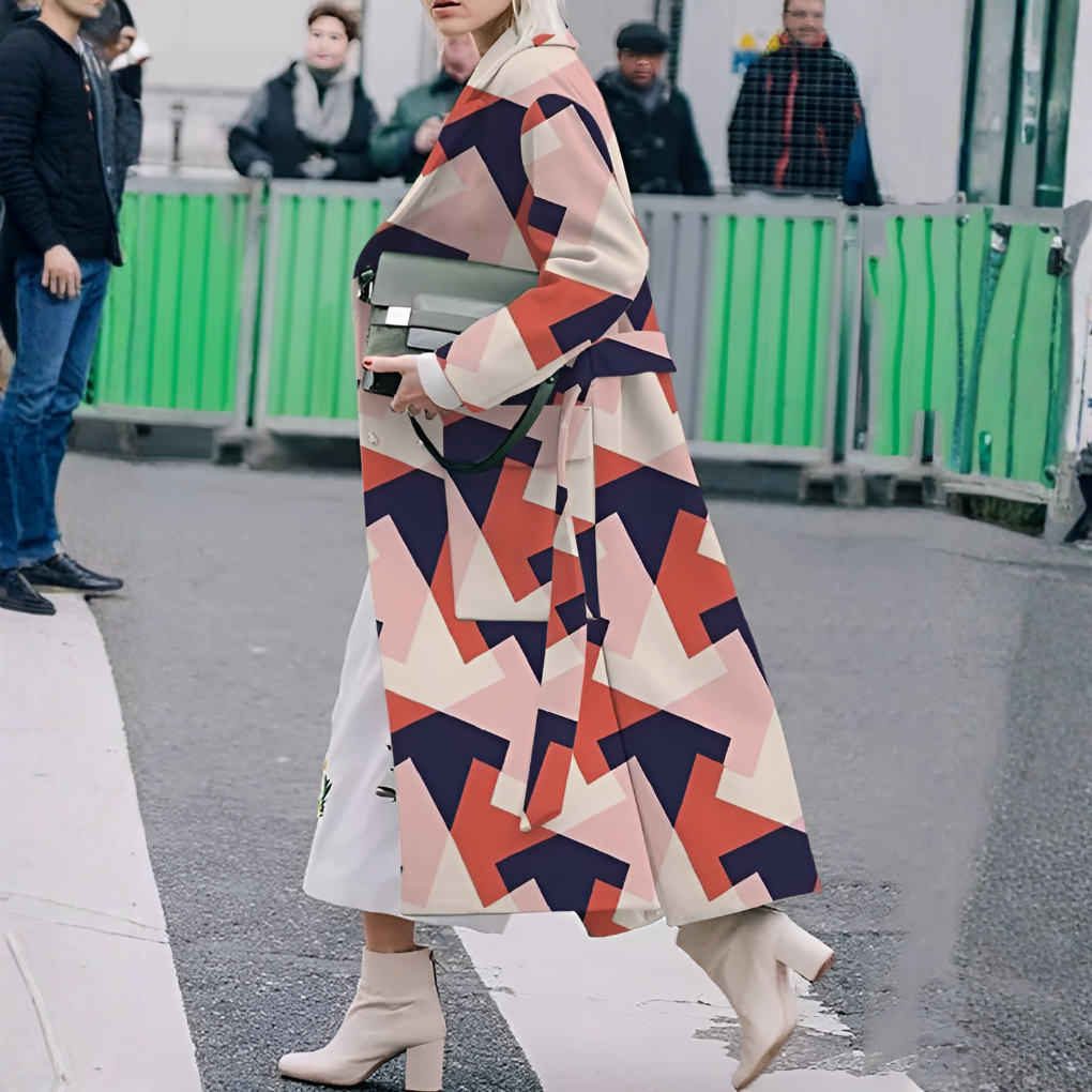 Women's fall fashion: Long waterproof rain coat with button detailing, ideal for outerwear.
