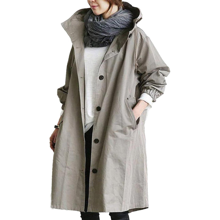 All-weather women's waterproof long raincoat. Stylish and practical outerwear for casual outdoor protection.