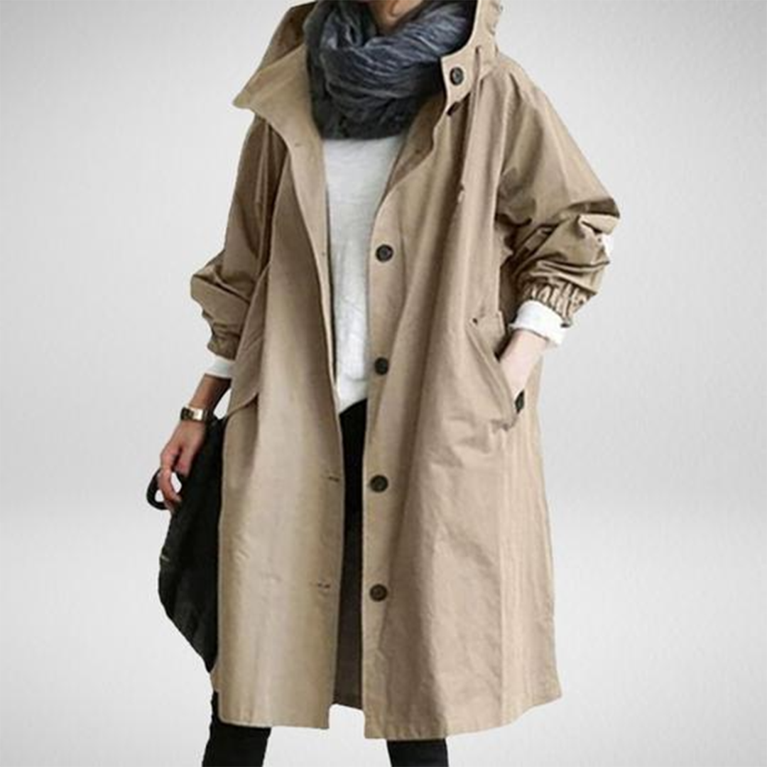 Women's stylish waterproof long raincoat, an essential trench coat for reliable outdoor protection.