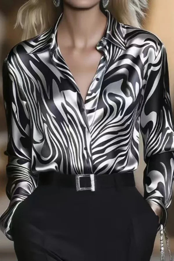 Sophisticated women's animal print button-down blouse with long sleeves, ideal for office or stylish evening wear.