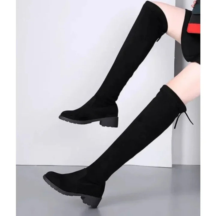 Stylish women's black thigh-high boots with a sturdy block heel, perfect for fashion