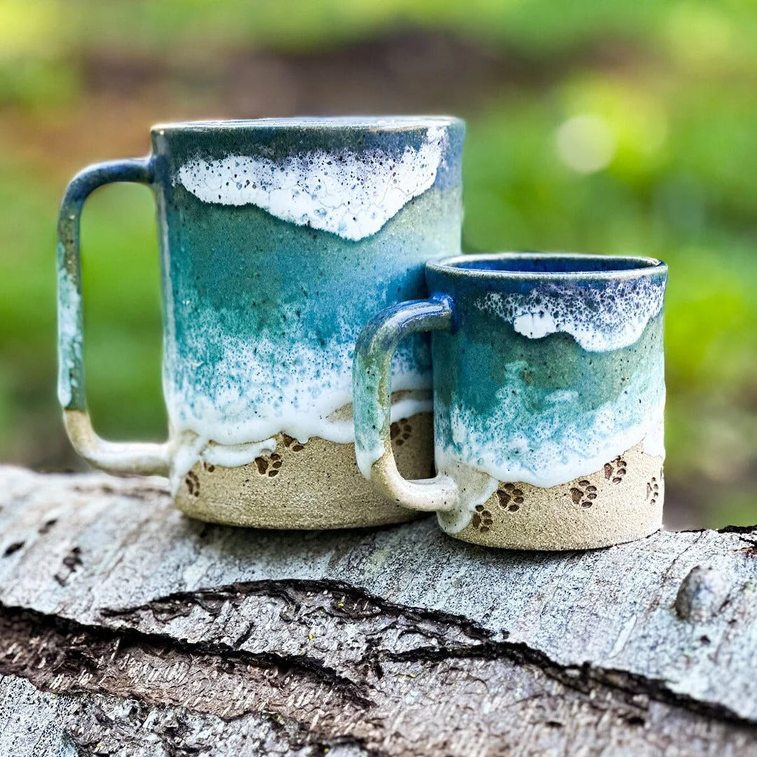 Textured ocean blue coffee mug with a delicate paw print, handmade drinkware, 12 oz capacity