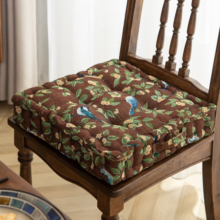 Comfortable green padded seat cushion for dining & patio chairs, a durable furniture accessory.