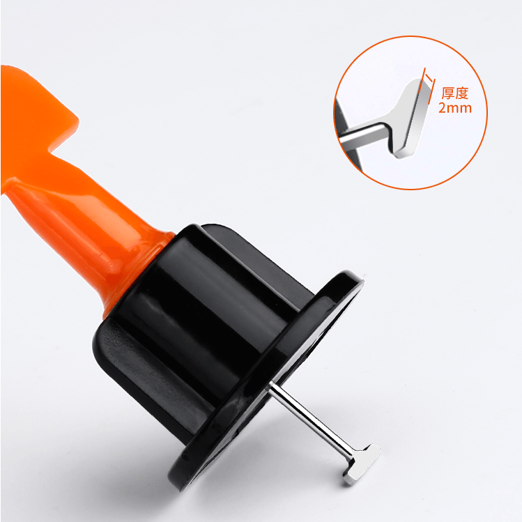 Hand holding a tile leveling plier, securely tightening wedges for an even and efficient tile installation.