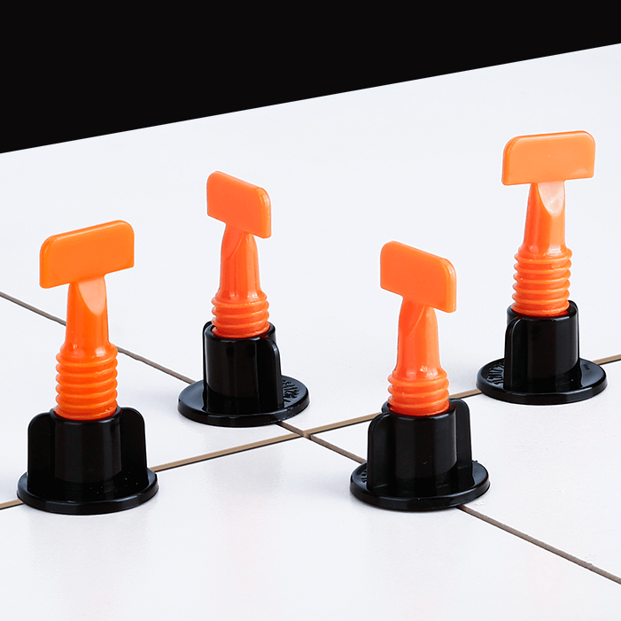 Demonstration of tile leveling tools in use on a bathroom wall, ensuring perfect alignment for ceramic tiles.