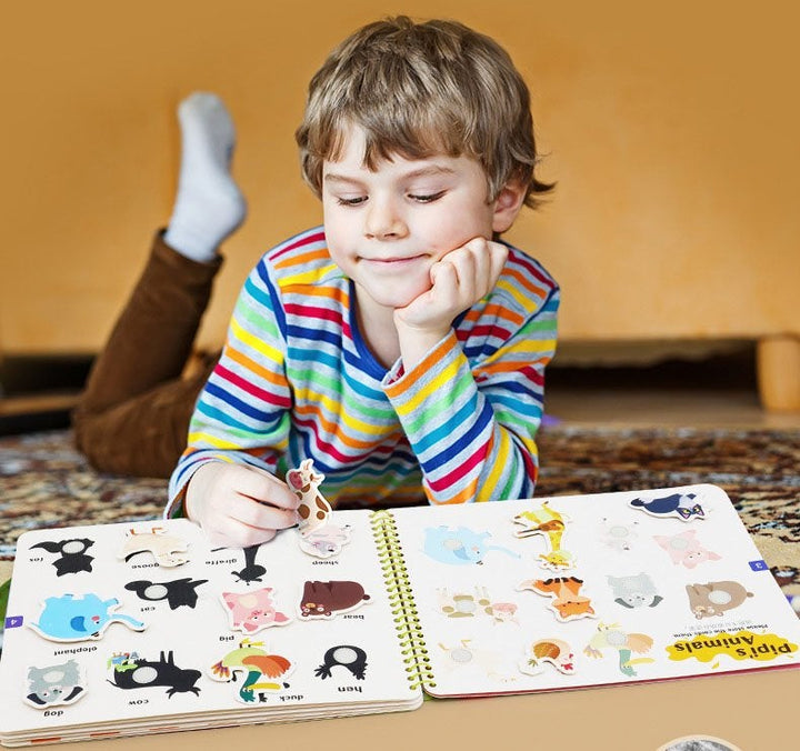 Toddler Activity Busy Book opened to a puzzle page, fostering problem-solving and fine motor skills