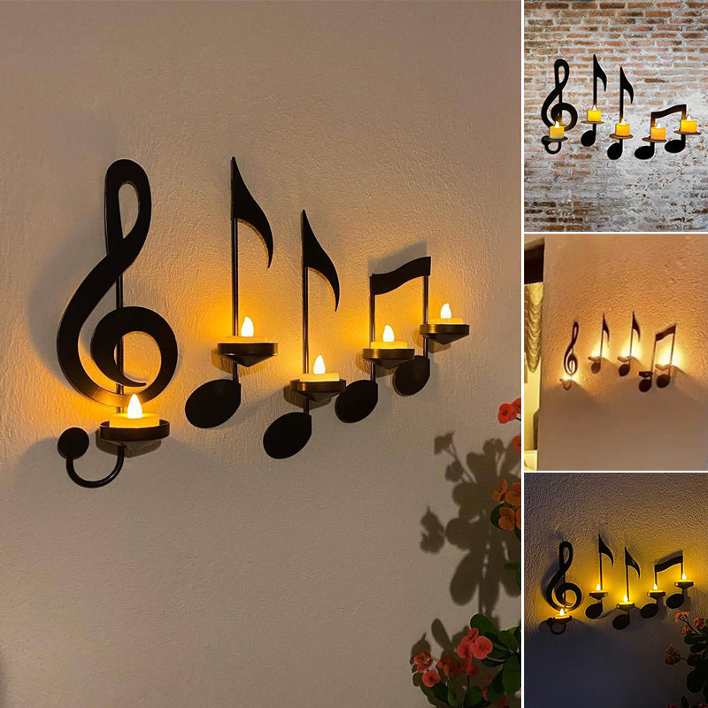 Ornate music notes crafted from metal, forming a wall sconce for a glowing candle