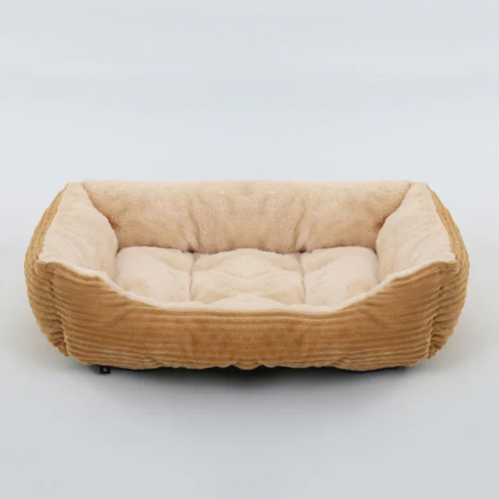Large calming dog bed, ultra soft plush for ultimate comfort. Washable pet bed, cozy rest for your furry friend.
