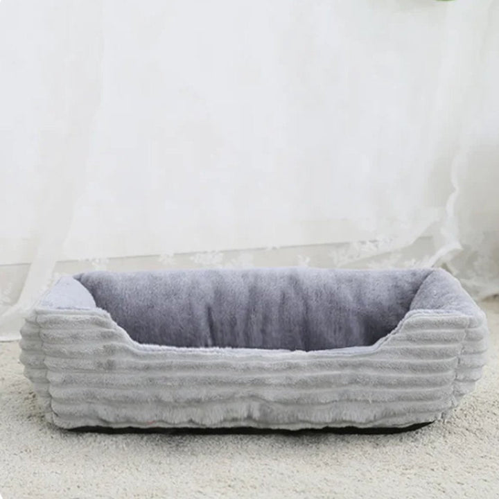Small calming dog bed, ultra soft plush for ultimate comfort. Washable pet bed, cozy rest for your furry friend.