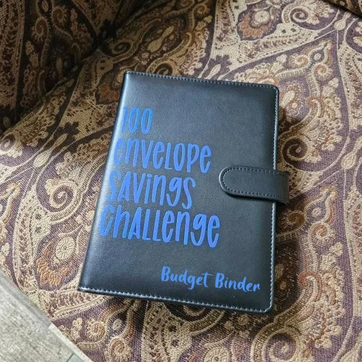 Empty 100 Envelope Challenge Binder pages, ready for a person to start their savings journey