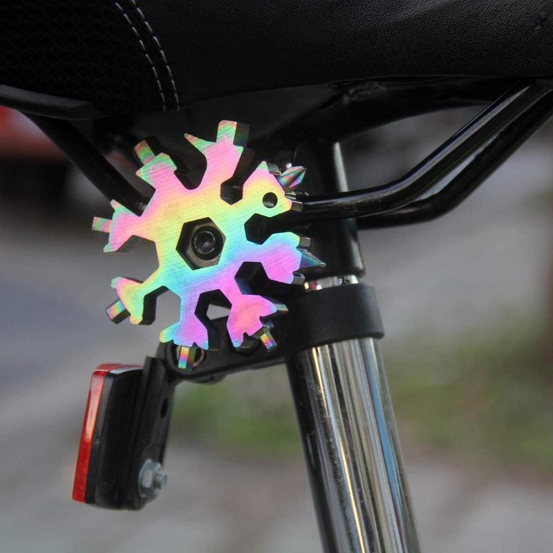 Collection of 18-in-1 snowflake multi-tool keychains, a great gift idea for outdoor enthusiasts