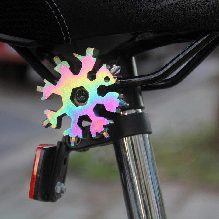 Collection of 18-in-1 snowflake multi-tool keychains, a great gift idea for outdoor enthusiasts