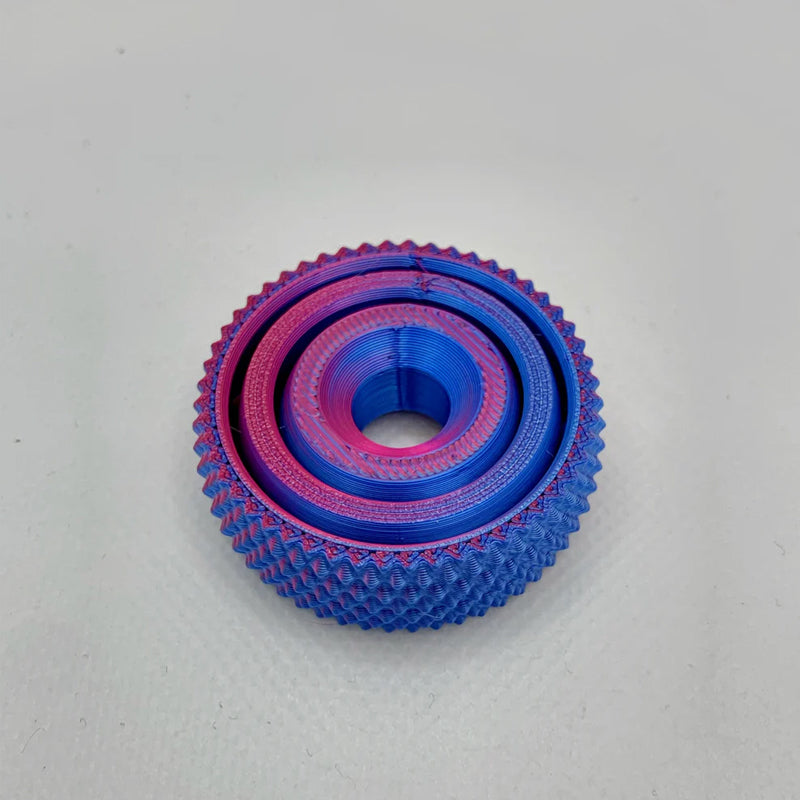 Vibrant blue Unisex 3D Concentric Ring Fidget Ball, a fun sensory decompression toy