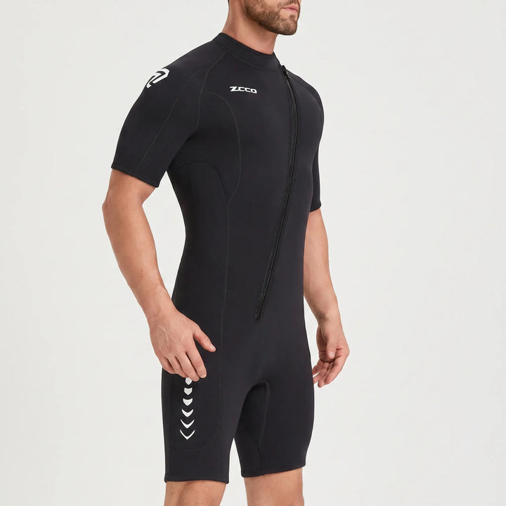 Close-up of a black 3mm shorty wetsuit with front zipper, ideal for surfing and diving.