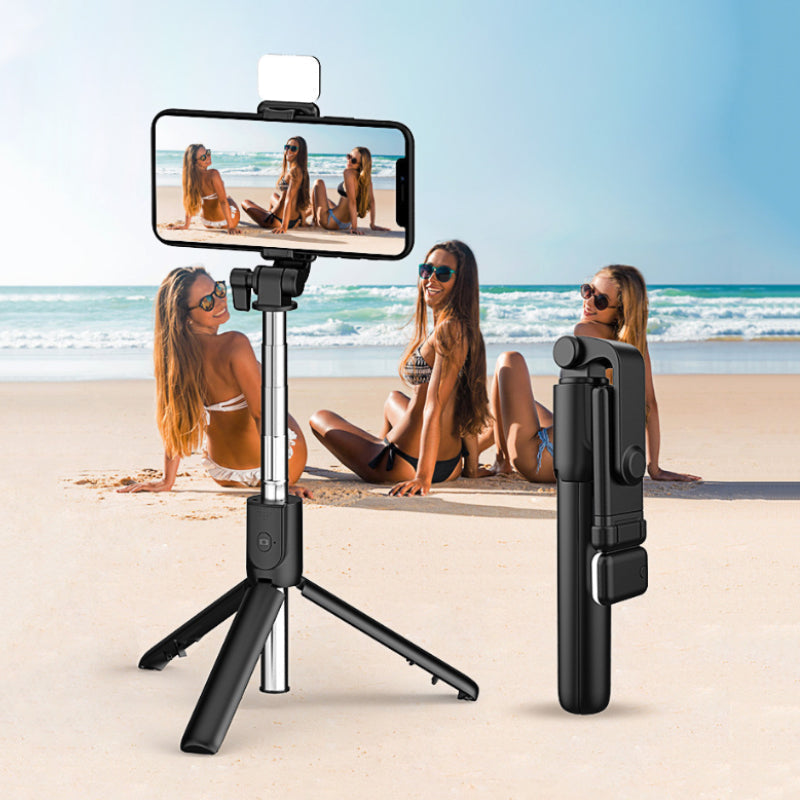 Folded wireless selfie stick tripod with integrated fill light, compact phone accessory