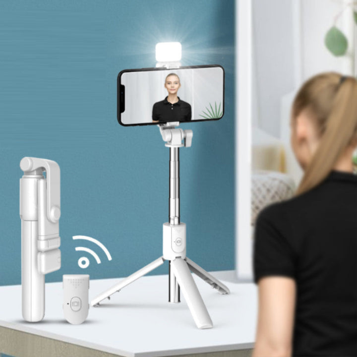 Wireless remote control for the selfie stick tripod, showing Bluetooth connectivity