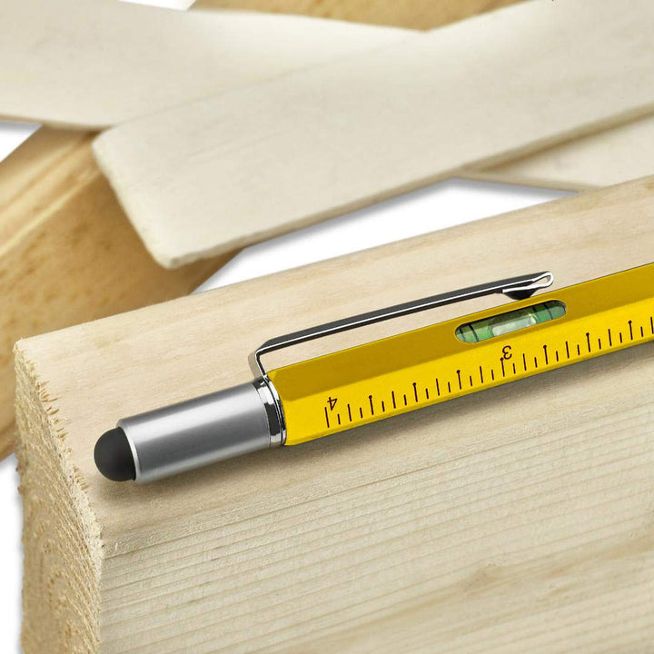 Demonstration of the multifunction stylus pen being used as a ruler on a notepad. Office gadget.
