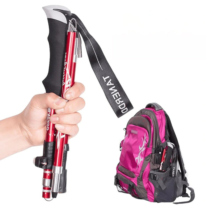 Hiker using adjustable trekking poles on a mountain trail. Essential lightweight walking sticks for outdoor adventure.