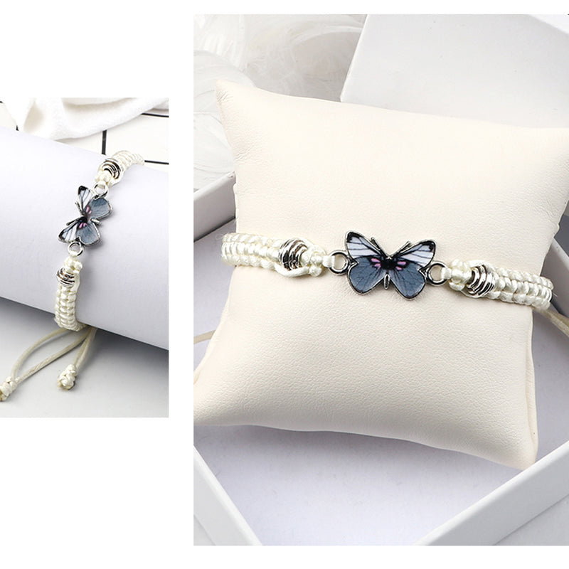 Handmade adjustable butterfly charm bracelet, woven cotton string, ideal unisex gift.