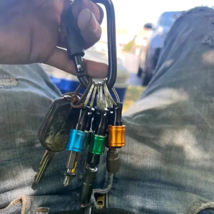 Unisex tool accessory: quick release hex bit holder carabiner for drill bits.