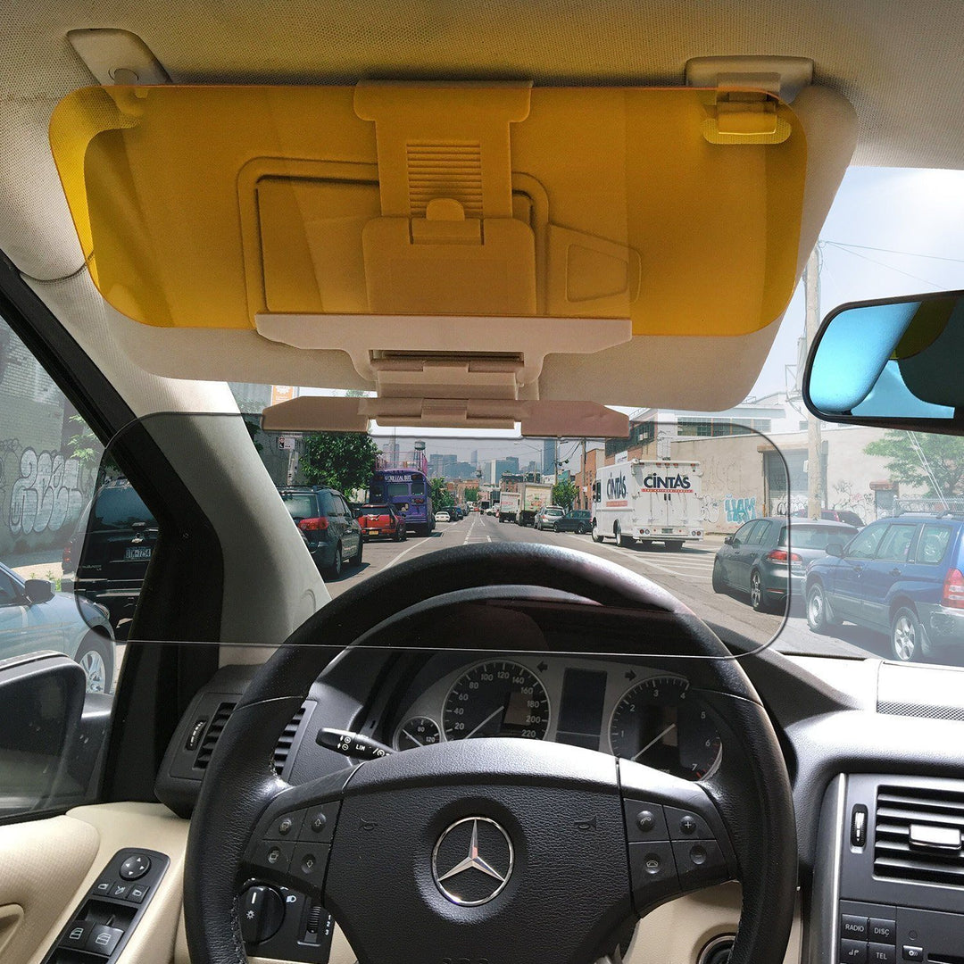 Close-up of a universal anti-glare car visor attached to vehicle interior; improves safety.