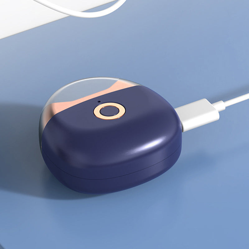 Hand holding a gray automatic electric nail clipper, demonstrating its compact size and ease of use
