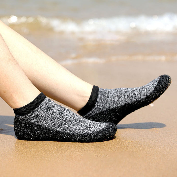 Grey unisex yoga socks, designed for improved balance and flexibility in practice.