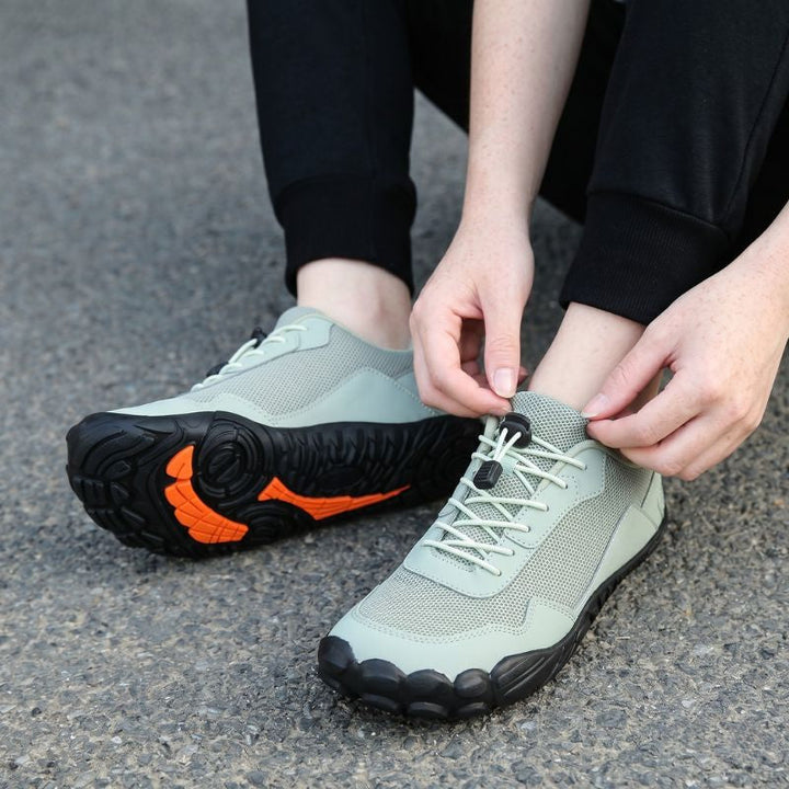 Unisex barefoot orthopedic hiking shoes on foot, showcasing wide toe box & natural fit for comfortable walking.