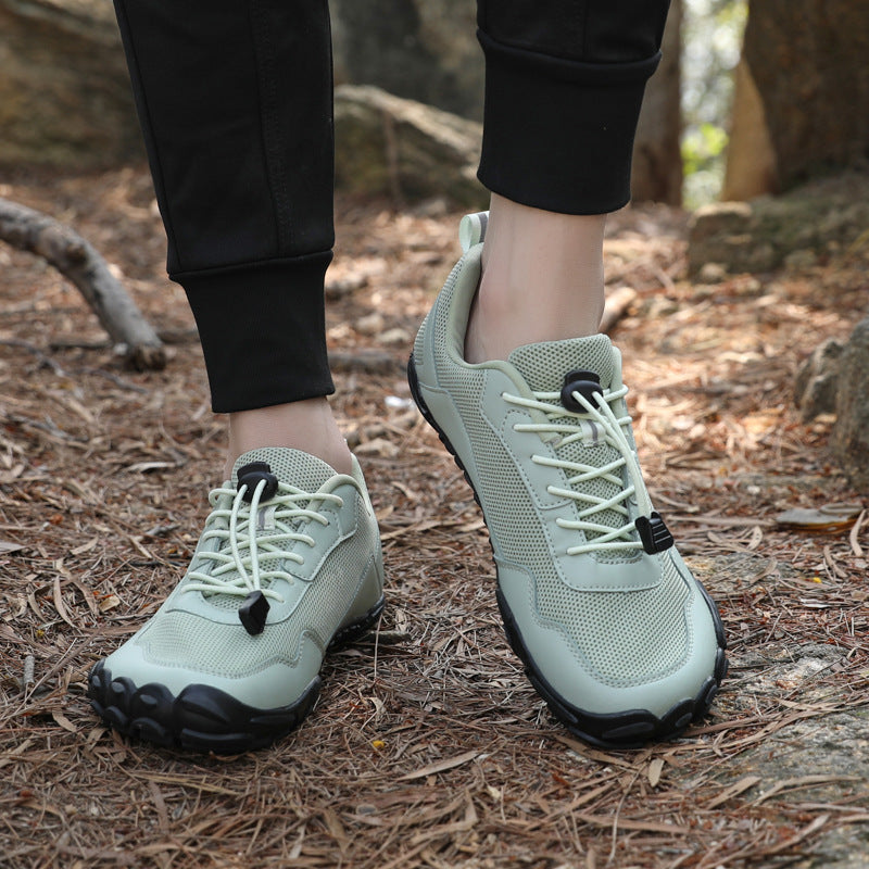 Unisex barefoot orthopedic hiking shoes in action on a trail, offering wide toe box & natural fit.