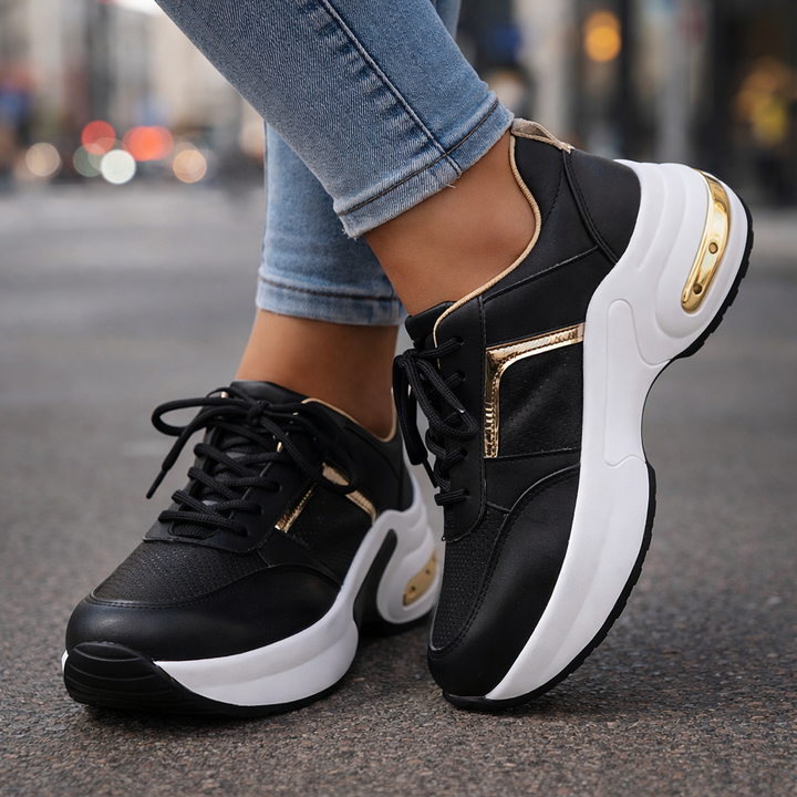 Unisex black athletic motion running shoes with white soles, designed for comfort and orthopedic support.