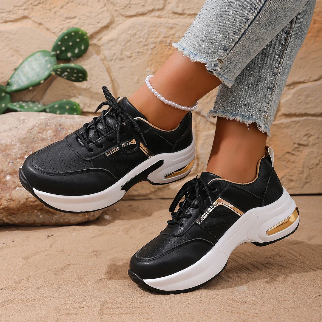 Close-up of the breathable mesh upper on a unisex athletic motion running shoe, black color.