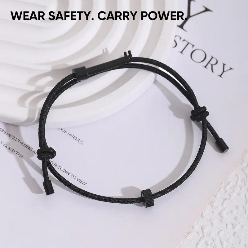 Hands demonstrating use of emergency window breaker bracelet for car glass breaking in emergency