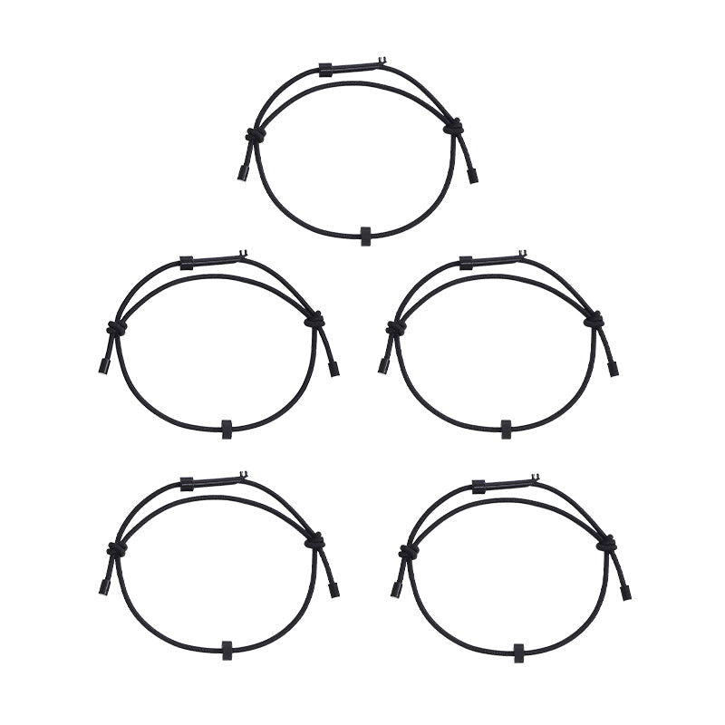 The emergency window breaker bracelet and key laid flat, showcasing its minimalist design