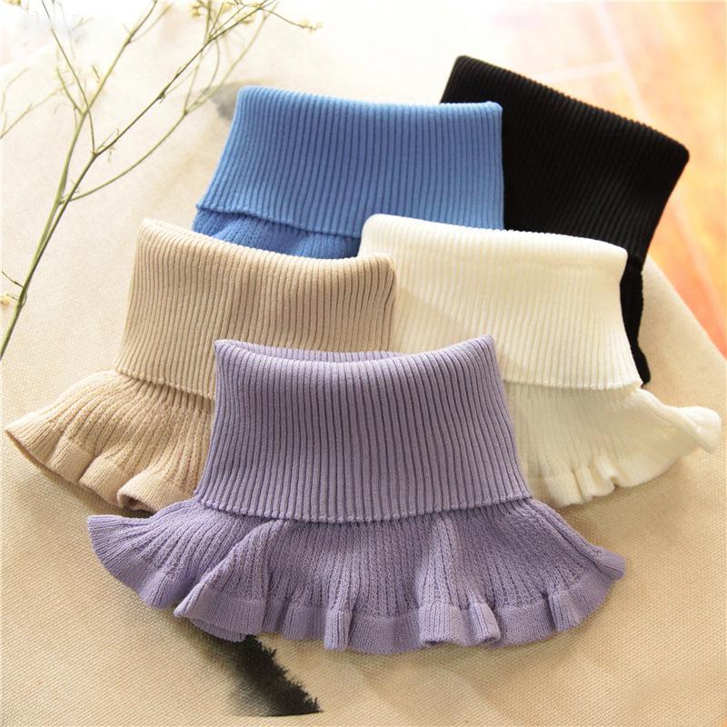 Model wearing a chunky cable knit dickey collar in a neutral color, warmth & style