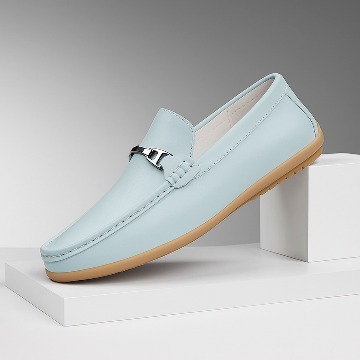 Unisex leather loafers on a white background, highlighting their versatile and classic appeal.