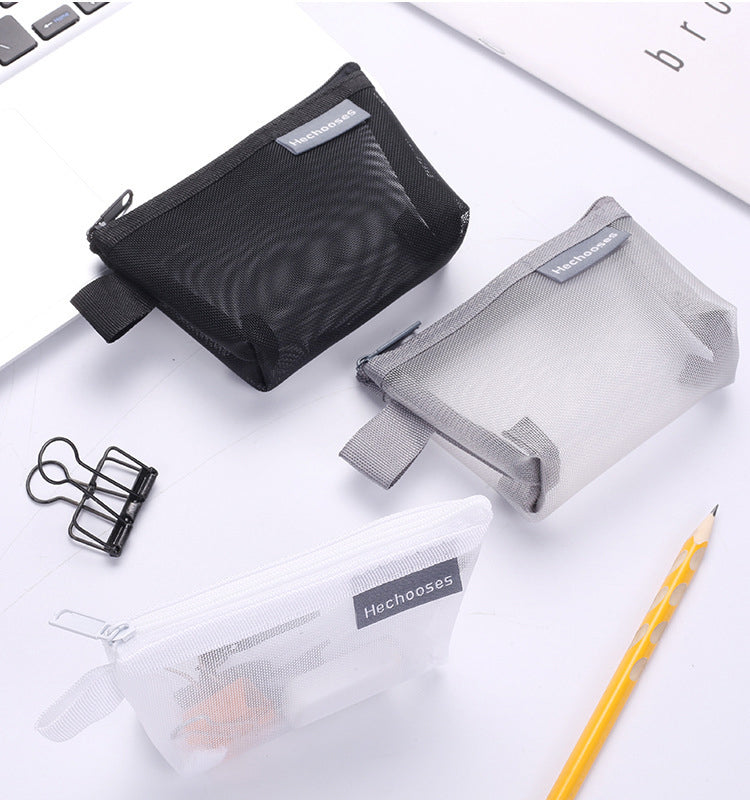 Portable grey mesh zipper pouch, great for toiletries or small gadgets while traveling.