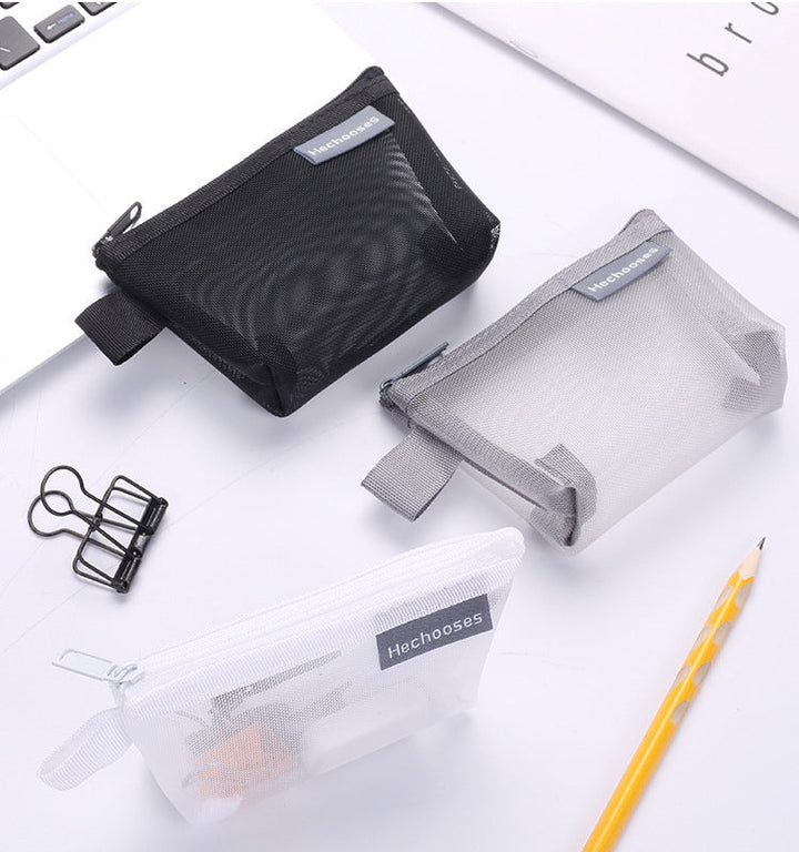 Portable grey mesh zipper pouch, great for toiletries or small gadgets while traveling.