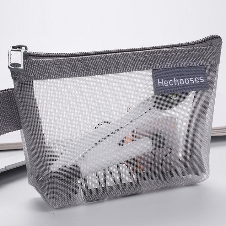 Versatile clear mesh pouch with zipper, suitable for office supplies or art materials.