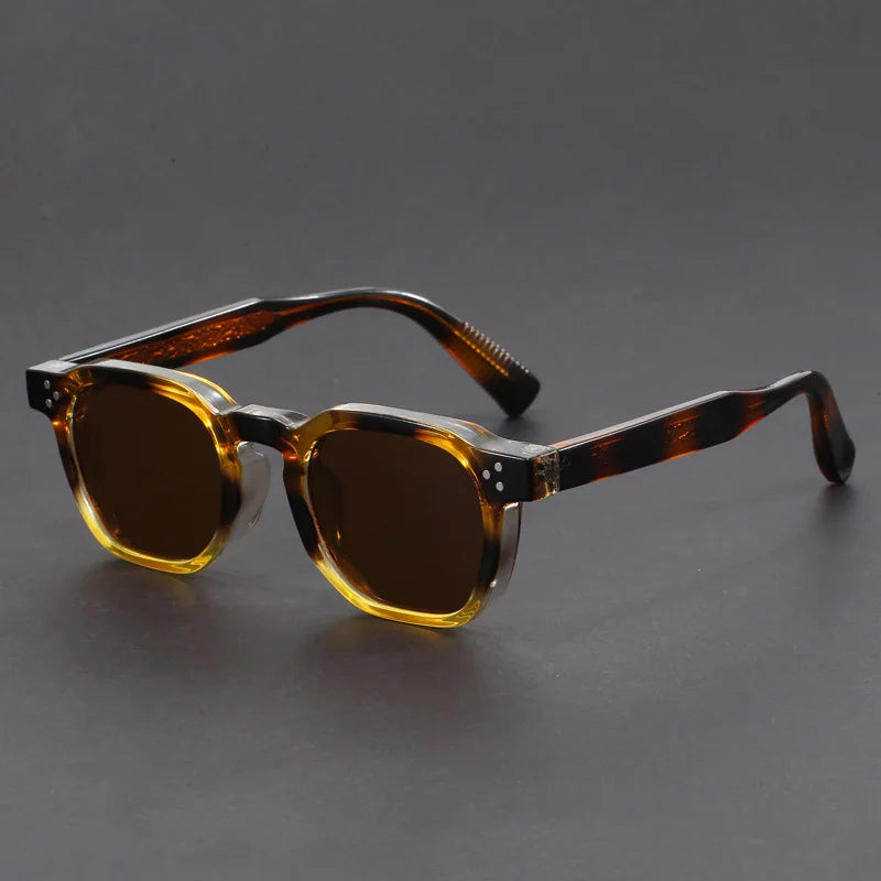 Modern unisex square frame sunglasses with thick edges and dark lenses, trendy fashion accessory.