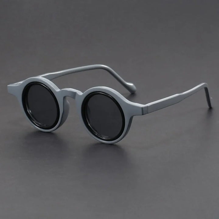 Unisex bold round frame sunglasses in black, a stylish fashion accessory for summer UV protection.