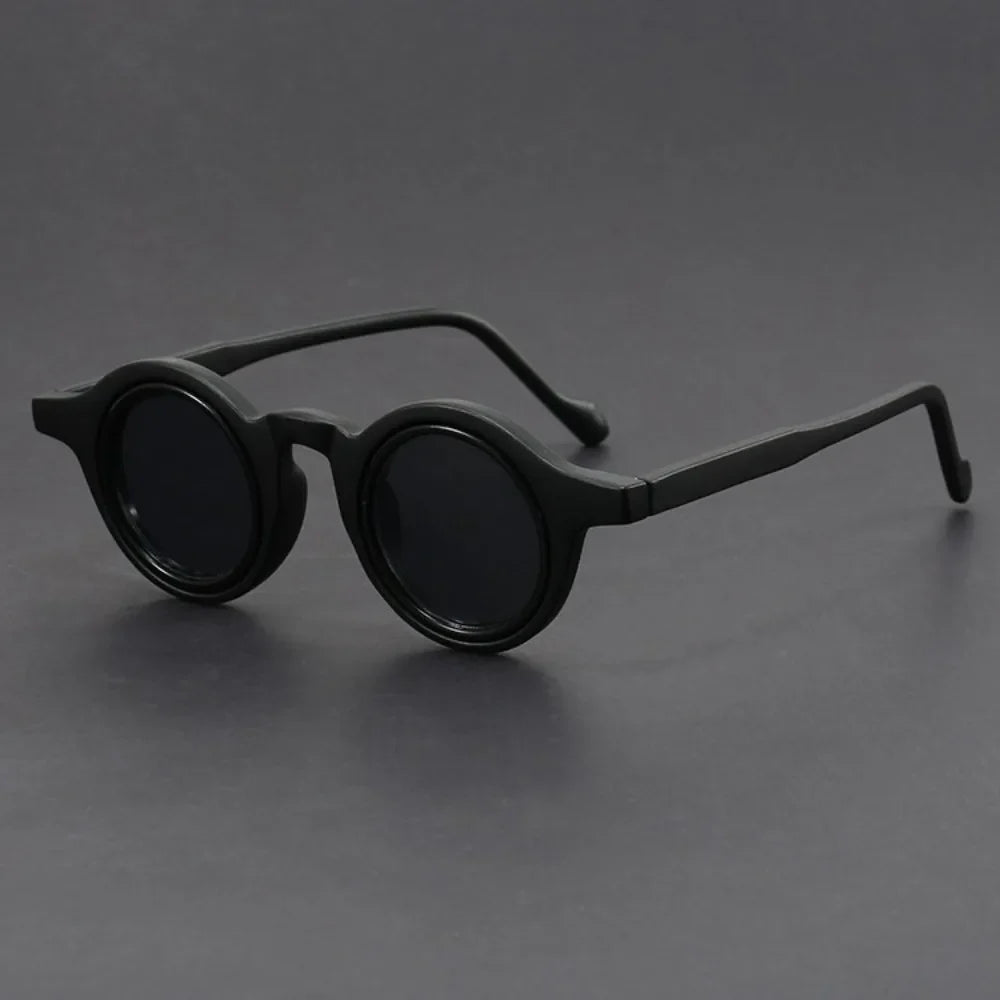 Bold round eyewear for men and women, black frames, perfect summer accessories for sun protection.