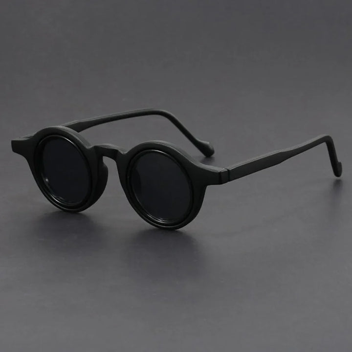 Bold round eyewear for men and women, black frames, perfect summer accessories for sun protection.
