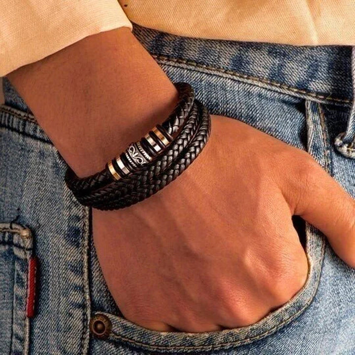 Close-up of a stylish braided leather bracelet, a double row design, suitable as a fashion accessory for men.
