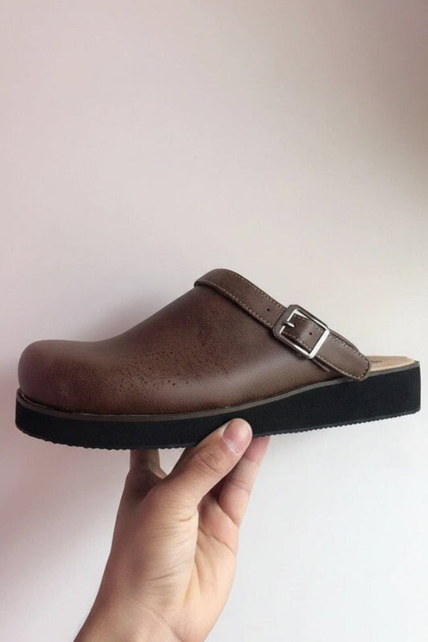 Black unisex slip-on clogs, offering comfortable daily wear and excellent foot support. Perfect for work or casual.