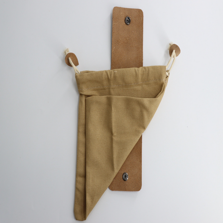 Bushcraft foraging pouch with a secure drawstring closure, ideal for collecting finds on hikes.