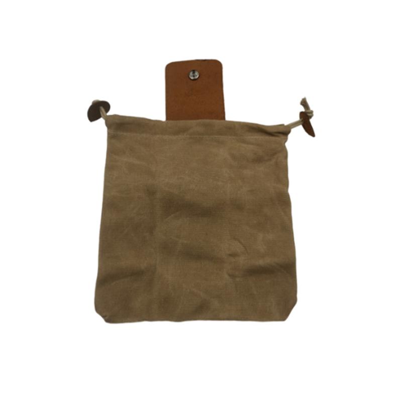 Unisex foraging pouch in a natural canvas color with rich brown leather accents, great for hiking trips.